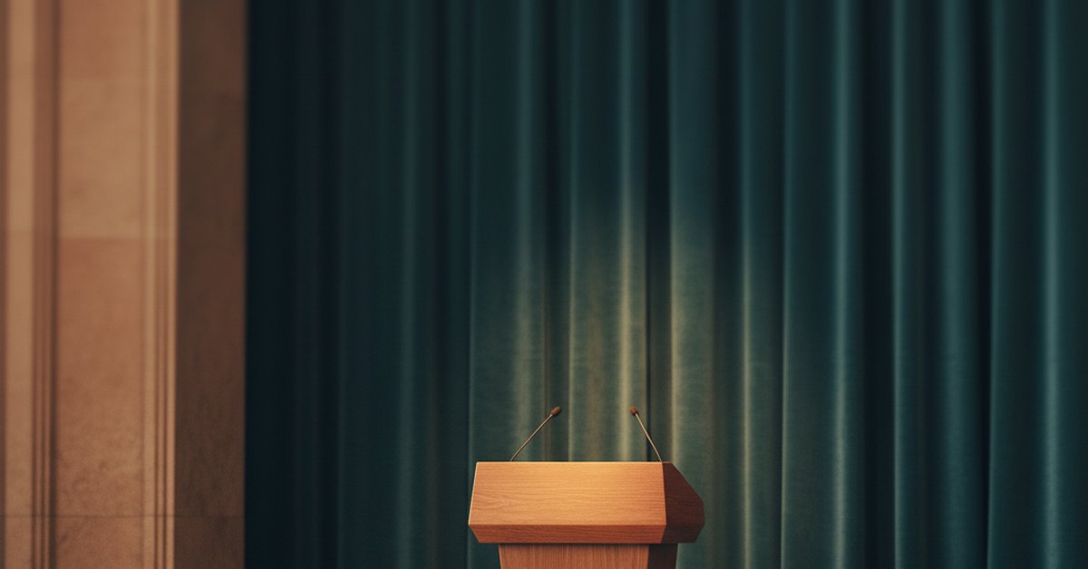 Empty corporate stage with podium and microphone under a spotlight before an announcement